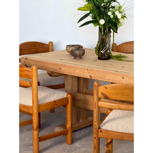 Swedish trestle dining table in solid pine, produced in Sweden circa 1970s. The top is built from thick, edge-joined pine...