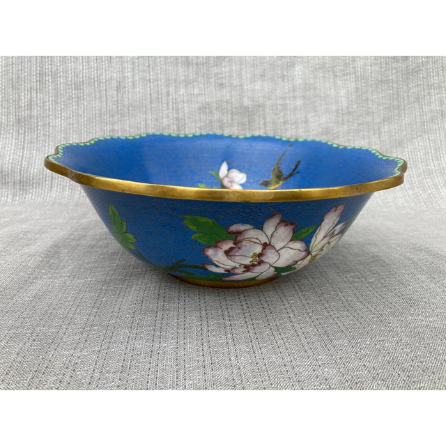 Pretty vintage Chinese blue floral and bird cloisonne bowl with a softly scalloped edge. Flowers and bird around the...