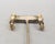 1989 goldtone looped design with oval clear rhinestones pierced push back hoop earrings. Marked "NAPIER©" on the backs....