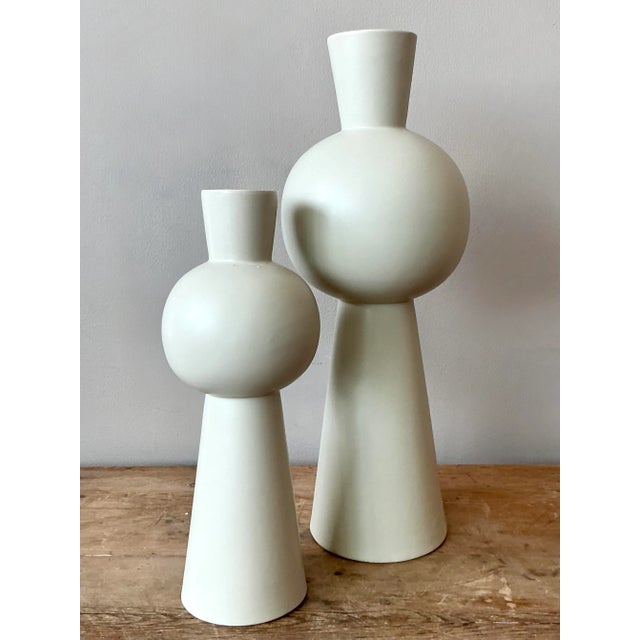 Elevate your interior with this striking set of two vintage glazed ceramic vases, embodying a sophisticated boho aesthetic...