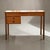 Compact danish writing desk executed in teak and produced in denmark during the 1950s. the desk reflects the restrained...
