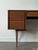 This classic 1960s Mid-Century Modern vanity desk is a masterclass in space-saving, dual-purpose Scandinavian design....