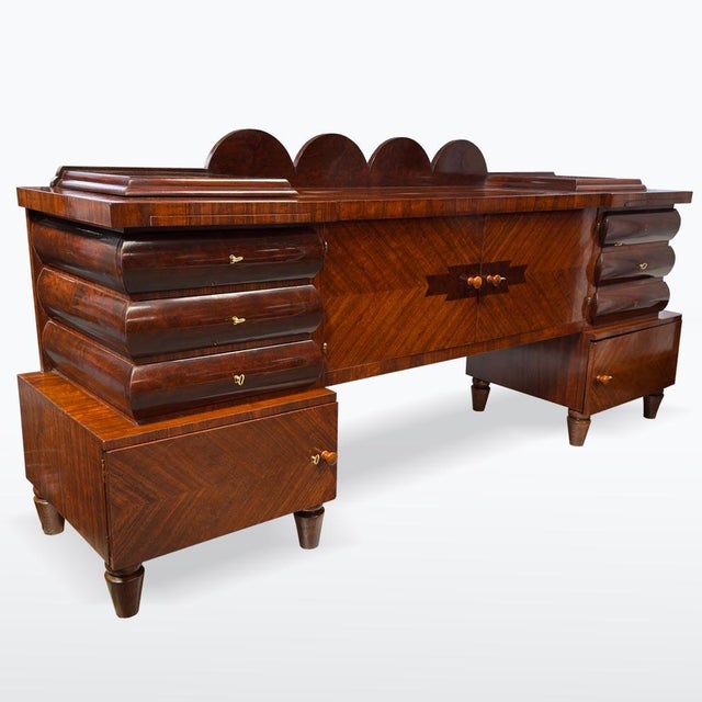 A striking sideboard in the unique style of Czech rondocubism, featuring bold rounded contours, geometric detailing, and...