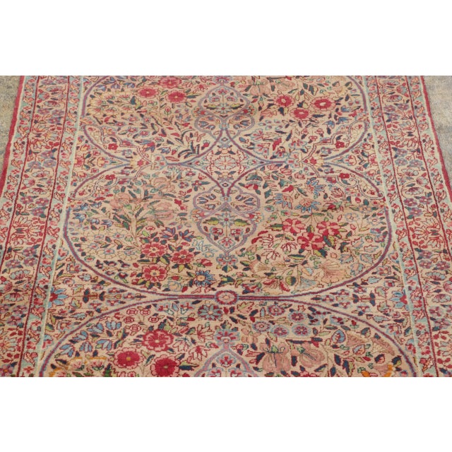 Made with hand-knotted wool circa 1890-1900, this 3x12 antique Kerman Lavar pair of runner rugs is an extremely rare and...