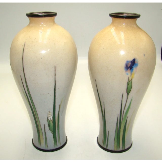 A rare and important pair of fine Japanese Meiji period enamel vases by the renowned imperial artist Namikawa Sosuke....