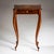 Delicate sewing table standing on slender, elegantly curved legs, crafted from finely polished walnut with beautiful...