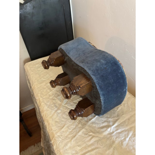 Floral Needlepoint footstool or ottoman. Kidney bean shape upholstered with a floral needlepoint top. Velvet/velour fabric...