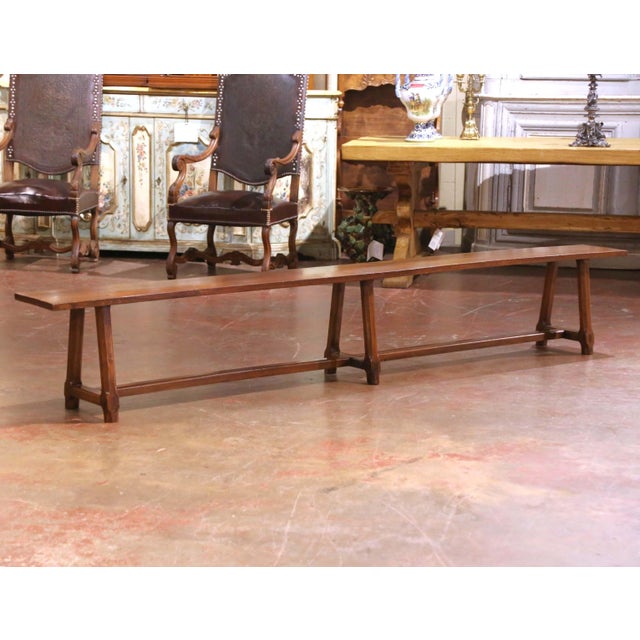 Bring understated farmhouse character to a dining room or kitchen with this elegant antique bench, crafted in the Poitou...