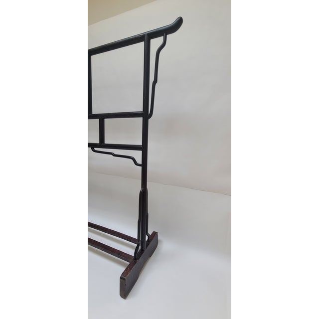 Cloth Rack The well finished frame members and the sharpness of joints indicates that this cloth rack was a product of a...