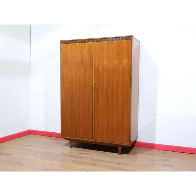 A beautiful Mid century wardrobe made by British furniture maker Butilux, this stunning example delivers plenty of storage...