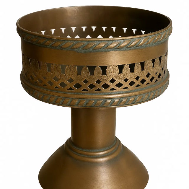 A handsome pair of English copper candlesticks stamped “P P T / Made in England,” likely produced by a small metalware...