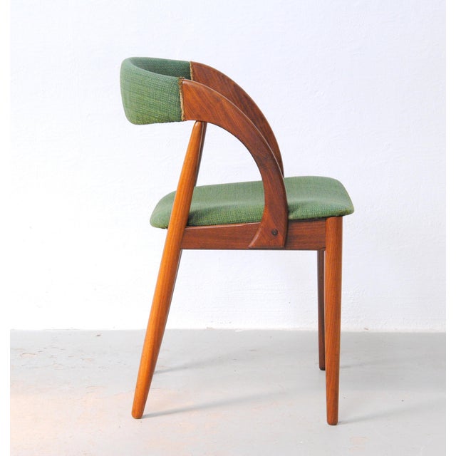 Organically shaped side chair in teak designed by the Danish designer Johannes Andersen. The comfortable chair features a...