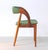 Organically shaped side chair in teak designed by the Danish designer Johannes Andersen. The comfortable chair features a...
