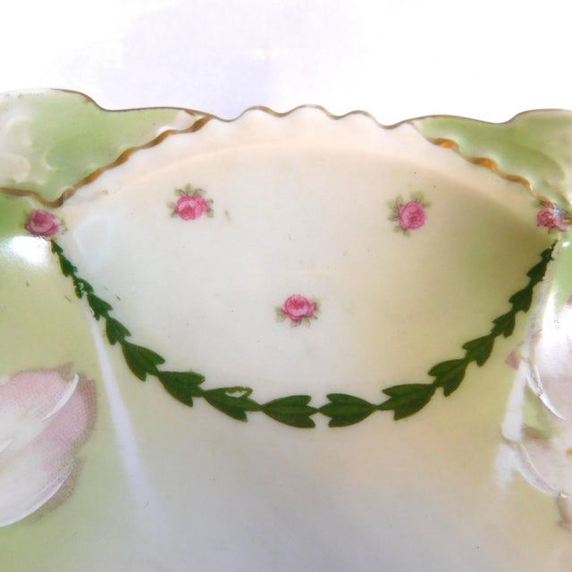 This is a green serving platter marked MZ Austria and Royal Innsbruck as shown. The plate is green with tiny pink flowers...