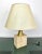 Table lamp by the Italian designer Fratelli Mannelli in a travertine base and brass structure featuring a removable...