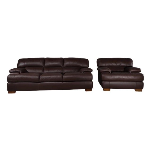 LOOM Studio Edition: a restored chocolate-brown leather lounge set with a three-seat sofa and a single lounge chair. Rich...
