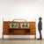 Sideboard with hinged doors, flap and visible drawers, in walnut veneered wood and silk-screened glass. This piece is...