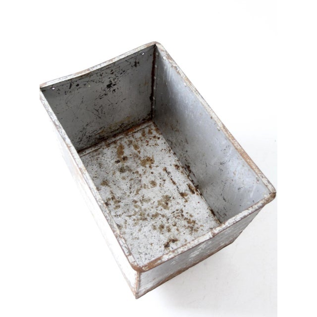 This early vintage industrial galvanized rolling bin is a stylish and functional piece. It features sturdy construction...