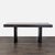 This West Elm dining set features a sturdy black wood table, a matching bench, and two chairs with woven seat cushions....