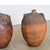 A pair of enormous 19th century French stoneware cruches traditionally used as a bottle or demijohn to transport and store...