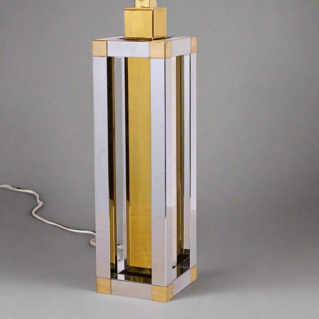 A Modernist table lamp designed by Stephane Davidts. Geometric form in patinated brass and chrome.