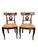 A refined pair of American Empire Revival dining chairs, dating to the late 19th to early 20th century. Executed in the...