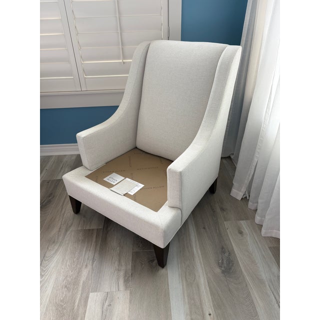 Comfortable living room or bedroom accent chair. Nice neutral ivory color with tapered legs so works with traditional,...