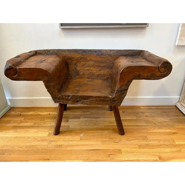 Wonderful 19th Century Indonesian Bench. Carved from one piece of Javanese Teak Root with generous proportions and carved...
