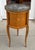 Antique French Marble Top Satinwood Inlaid Side Table. It features a rolling door that reveals hidden drawers.