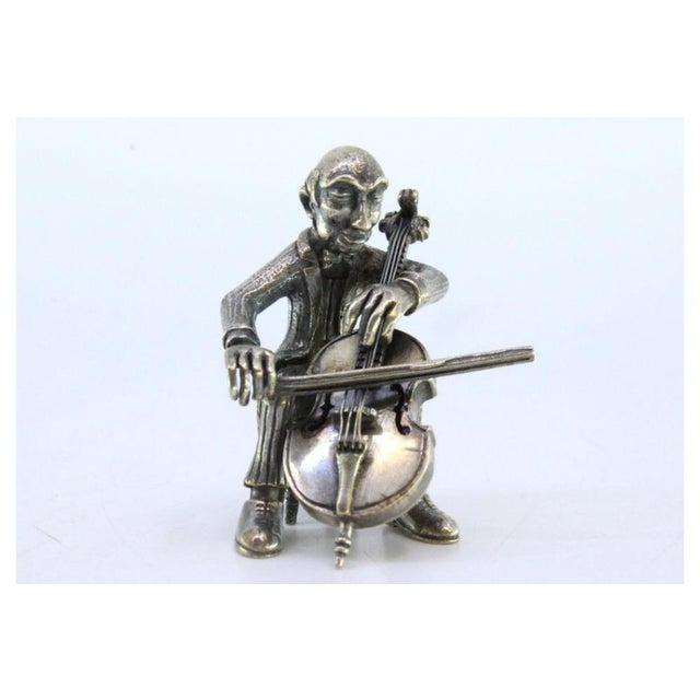 Silver Figure of Musician Playing the Cello, in Very Good conditions. Designed 1920 to 1949 This piece has an attribution...