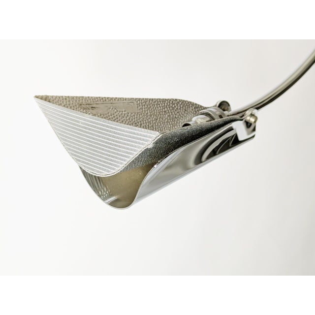 Sculptural chandelier in chrome plated metal and colored shaped glass, designed by Toni Cordero in the late 1990s and...