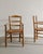 Rare pair of french mid century wooden armchairs attributed to charlotte perriand in stained elm and original straw...