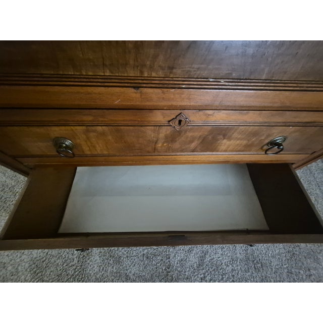 This beautiful hall tree showcases an oak frame with a central beveled mirror, unique ceramic tiles, carved accents, and...
