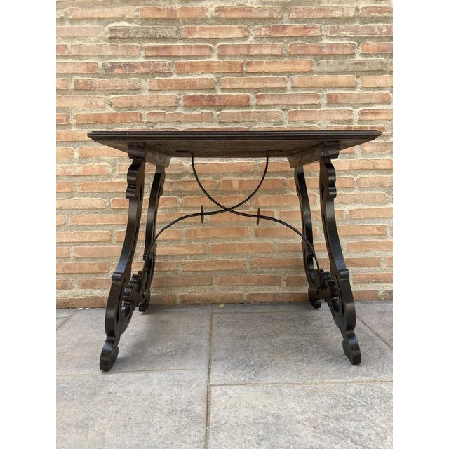 19th century Baroque Spanish side table with marquetry top 19th century Spanish trestle table in walnut. This piece has a...