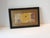 Vintage Framed French Printed Textile Fragment on Wood Frame Black wood frame, gold museum mat and clear glass inset....