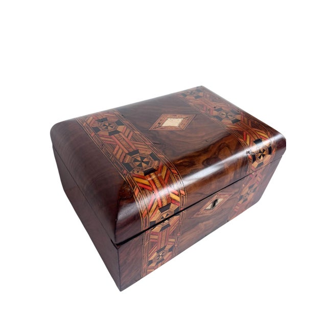 An attractive English Tunbridge Ware bridge box dating to the late 19th century. Crafted from mixed woods with the...