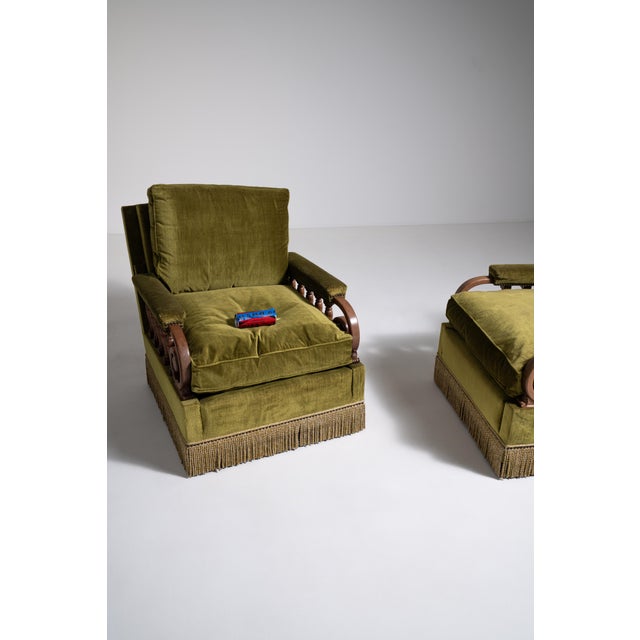 A refined pair of Danish armchairs reflecting early Scandinavian modern design, where simplicity and comfort take...