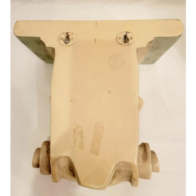 A wonderful pair of very heavy vintage plaster wall sconce shelves. The shelves feature a pretty carved design with a tan,...