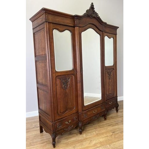 This striking Antique French Rocaille wardrobe is an exceptional statement piece, showcasing ornate craftsmanship, elegant...