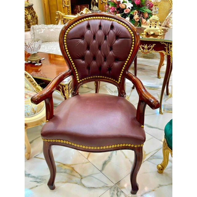 Add timeless sophistication to your interior with this elegant French-style armchair. Crafted from solid wood and...