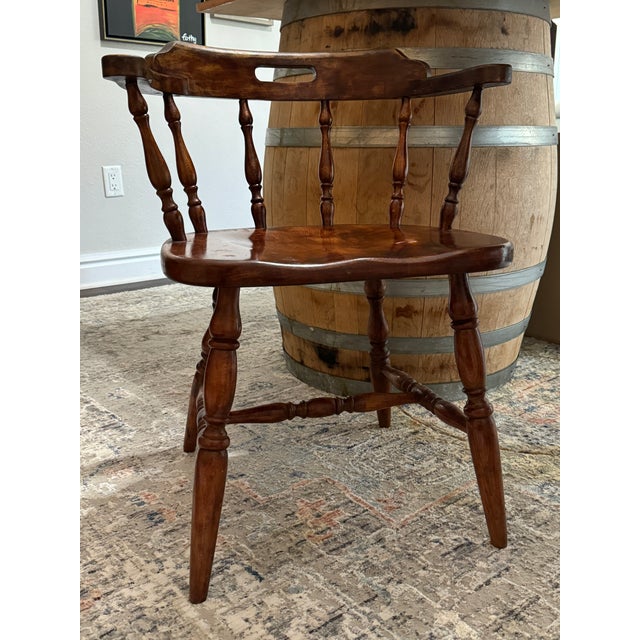 Elevate your interior with this striking Mid-Century Captain's Chair, designed to bring a touch of vintage pub or saloon...