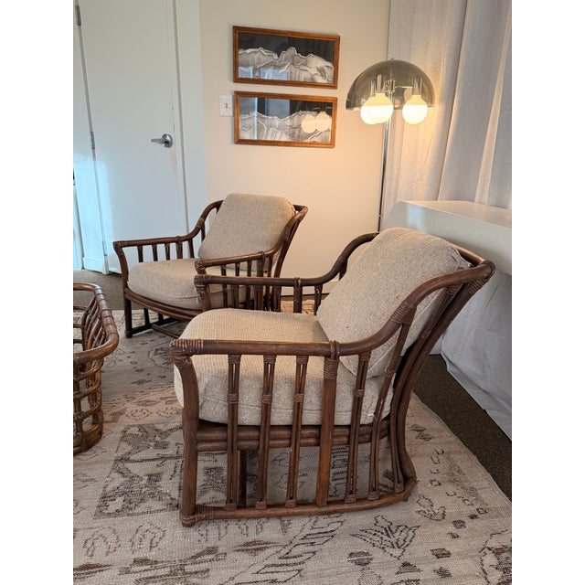 A rare and highly collectible Mid-Century Modern lounge chair set by Ficks Reed, featuring iconic sculptural rattan frames...