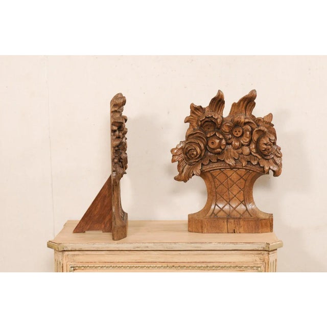A lovely pair of hand-carved wood floral baskets, tabletop decorations. This pair of wooden floral arrangements are nicely...