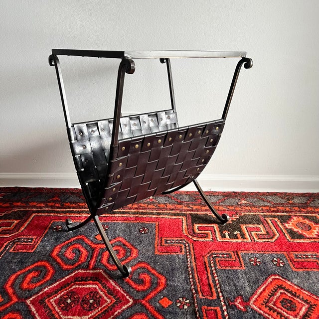 Vintage side table metal with a glass top insert. Woven faux leather magazine rack. Dimensions 18"W x 16"D x 23 5/8"H
