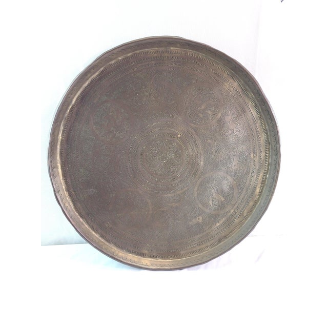 This is a large round Indian brass tray, likely dating from the early 20th century and attributable to the Benares...