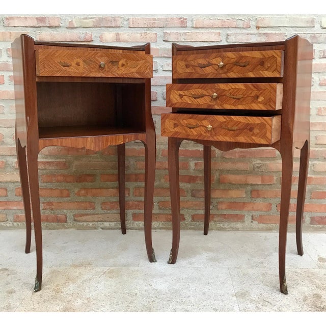 This elegant pair of bedside tables dates from the 20th century and is crafted in the Louis XV style. Each piece features...