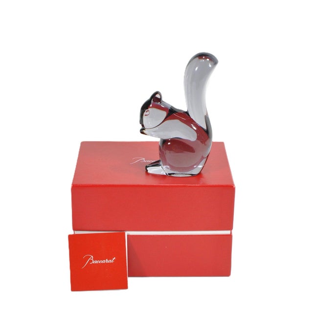 Capture the whimsical elegance of French luxury with this authentic Baccarat clear full-lead crystal squirrel figurine...