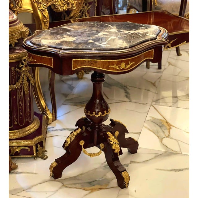 Bring timeless French elegance into your home with this exquisite Louis XVI-inspired round side table. Crafted from...