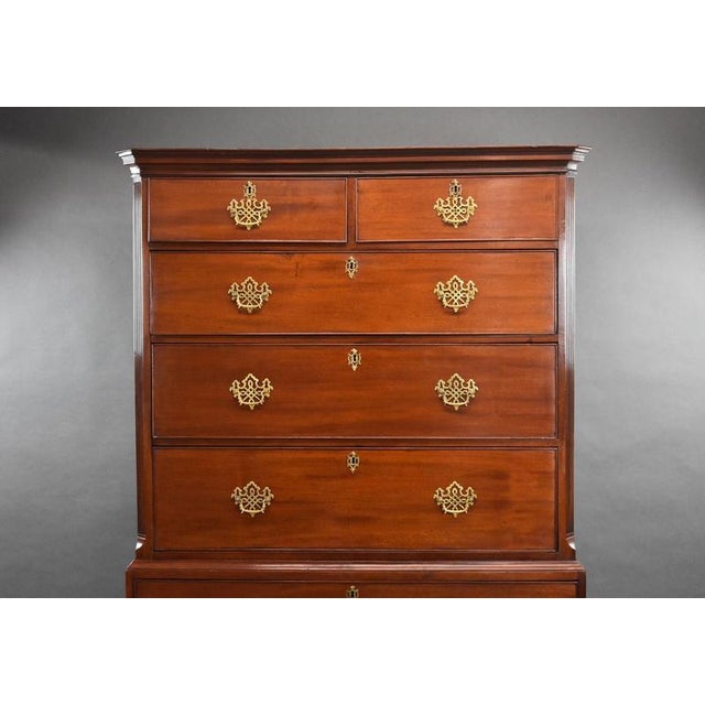 For sale is a good quality George III mahogany chest on chest, having a total of seven graduated drawers, each with brass...