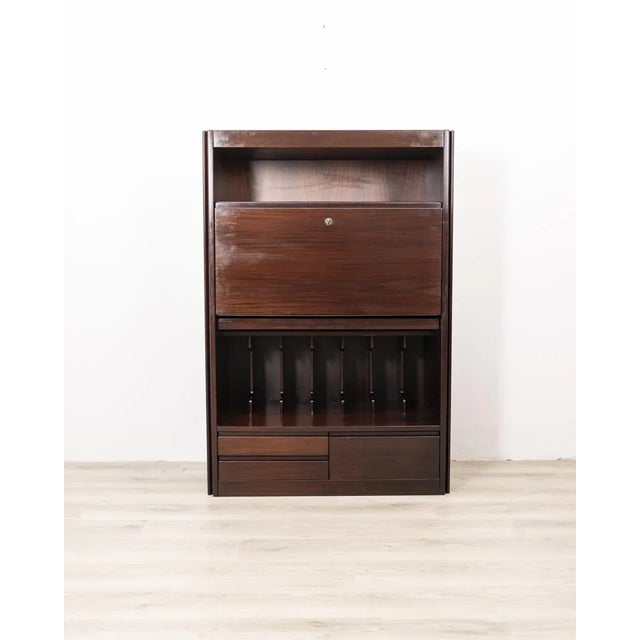 Sideboard in rosewood, central folding drawer acting as a desk with key, design Angelo Mangiarotti for Molteni, 1960s. I...